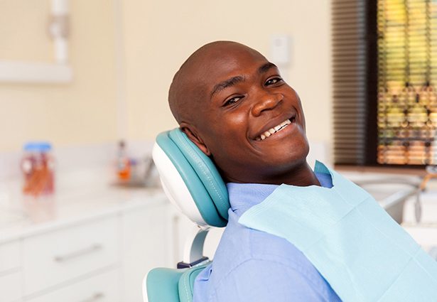 Alt image tag: happy patient enjoying a visit with a MetLife dentist in Pittsburgh