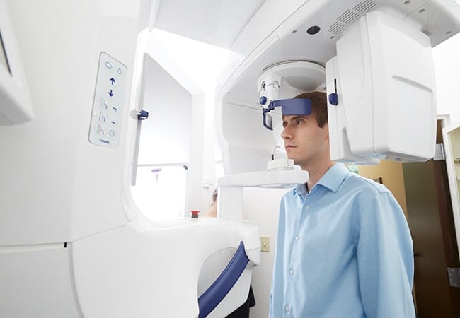 Patient receiving 3 D C T x-ray scans