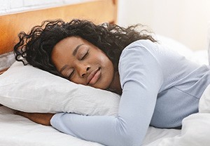 Woman resting in a bed