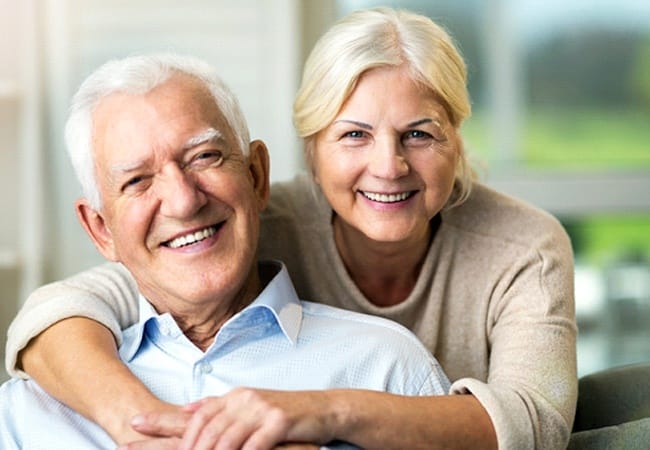 Relaxed senior couple enjoying the benefits of All-on-4