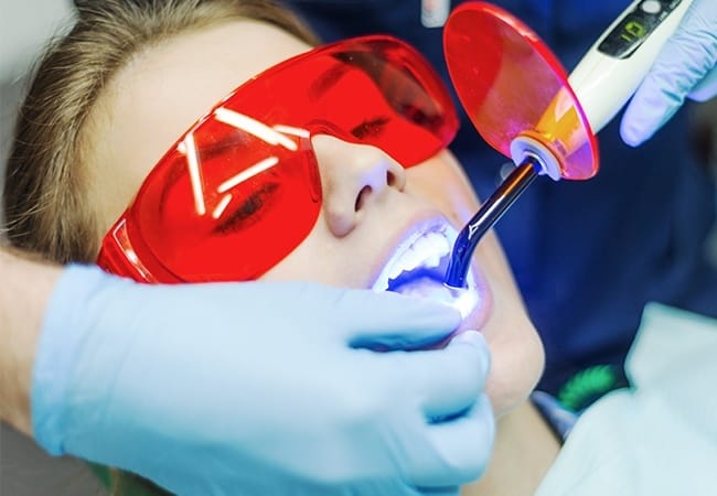 Patient receiving cosmetic dental bonding treatment