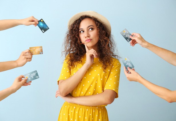 Woman surrounded by credit cards