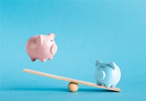 Piggy banks on a balance scale