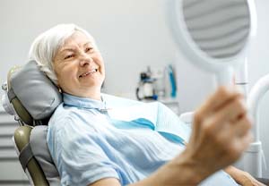 Woman smiling with dental implants in Pittsburgh