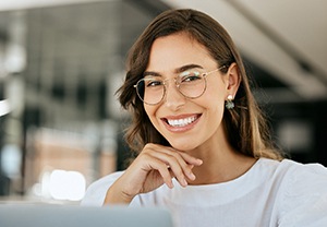 Woman with glasses smiling