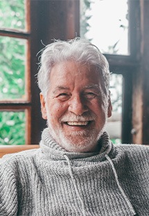 Closeup of senior man smiling at home