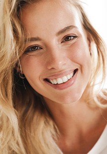 Closeup of woman with blonde hair smiling