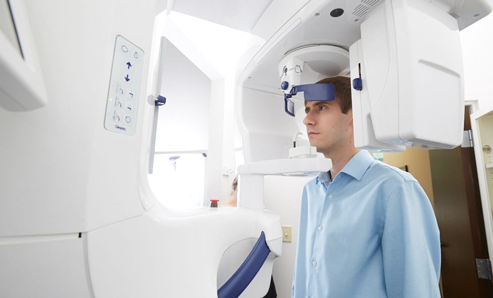 Patient receiving 3 D C T cone beam x-ray scans