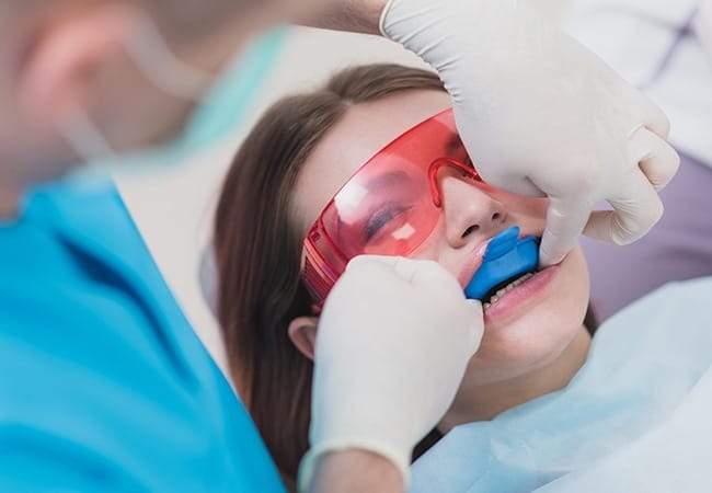 Patient receiving fluoride treatment