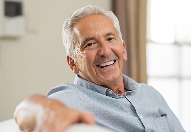 Man sharing smile after full mouth reconstruction