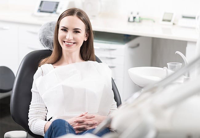 Woman smiling after root canal therapy