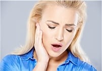 Tired, yawning woman in need of sleep apnea therapy