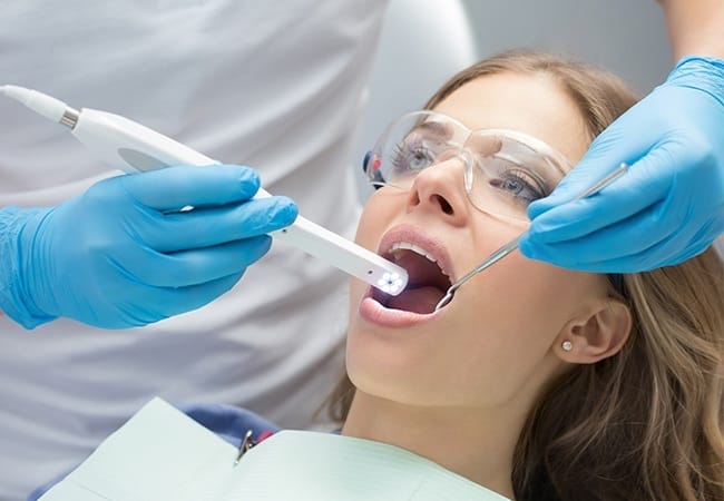 Dentist capturing intraoral images