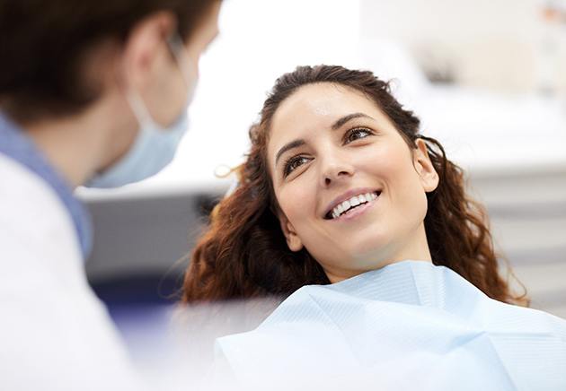 Dentist and patient discussing candidacy for TeethXpress treatment