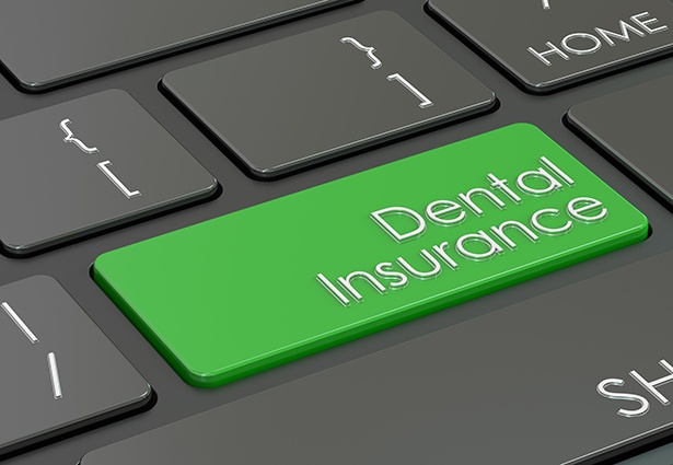 Green dental insurance button on keyboard