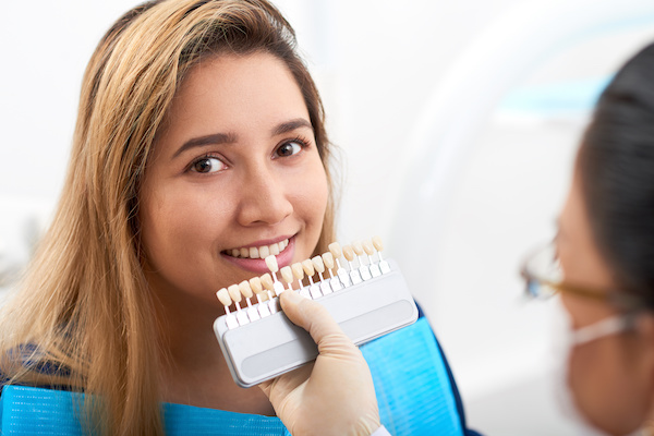 woman being prepped for teeth whitening procedure