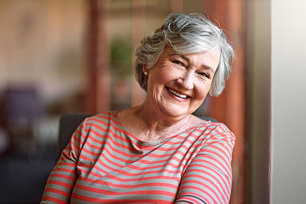 person smiling after receiving dental implants