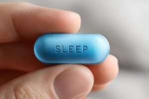 Close-up of sleeping pill in person’s hand